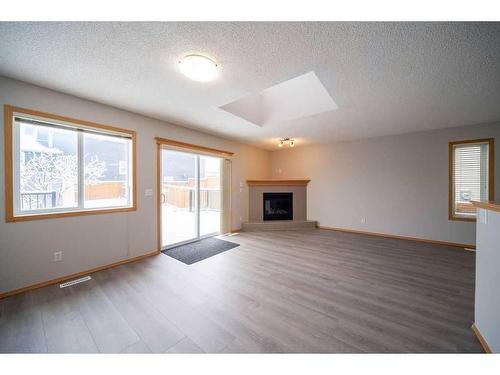 14 Taralea Bay Ne, Calgary, AB - Indoor Photo Showing Other Room With Fireplace