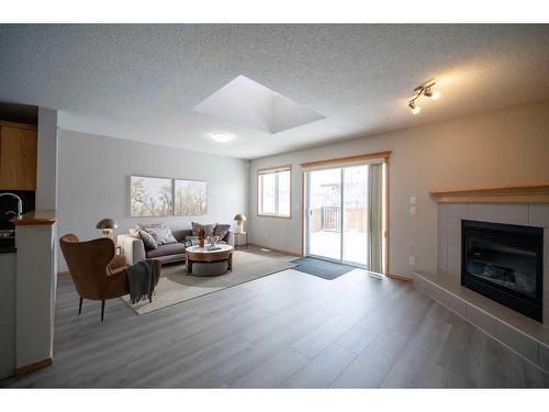 14 Taralea Bay Ne, Calgary, AB - Indoor Photo Showing Living Room With Fireplace