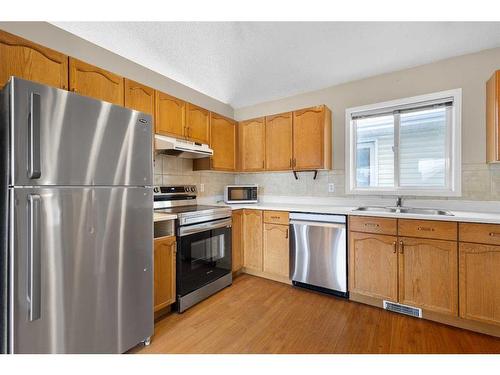 92 Covington Rise Ne, Calgary, AB - Indoor Photo Showing Kitchen With Double Sink