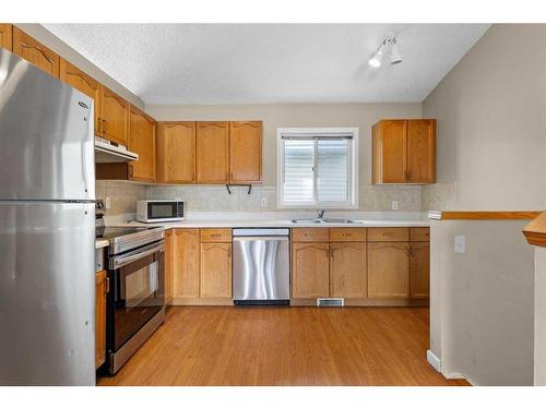 92 Covington Rise Ne, Calgary, AB - Indoor Photo Showing Kitchen With Double Sink