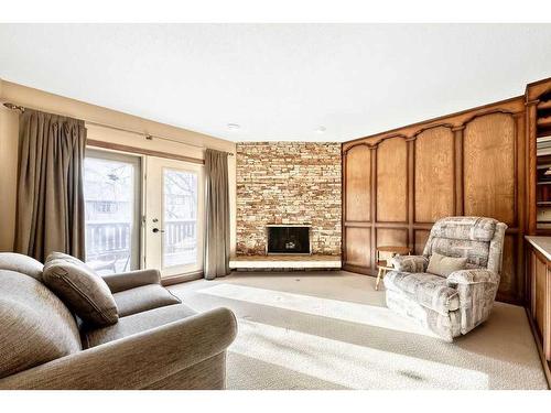 104 Hawkwood Crescent Nw, Calgary, AB - Indoor Photo Showing Living Room With Fireplace