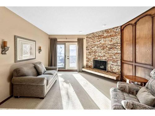 104 Hawkwood Crescent Nw, Calgary, AB - Indoor Photo Showing Living Room With Fireplace