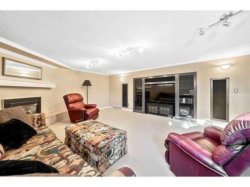 104 Hawkwood Crescent Nw, Calgary, AB - Indoor Photo Showing Living Room With Fireplace