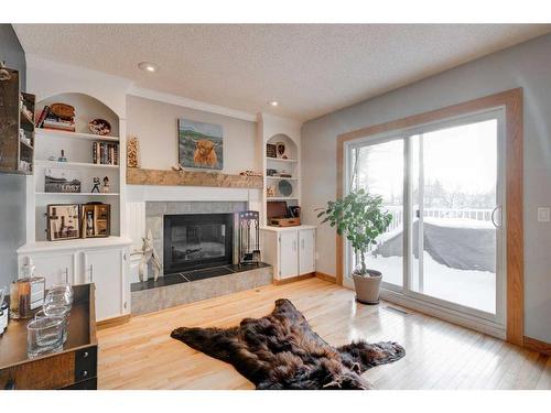 16 Ranchridge Crescent Nw, Calgary, AB - Indoor Photo Showing Living Room With Fireplace