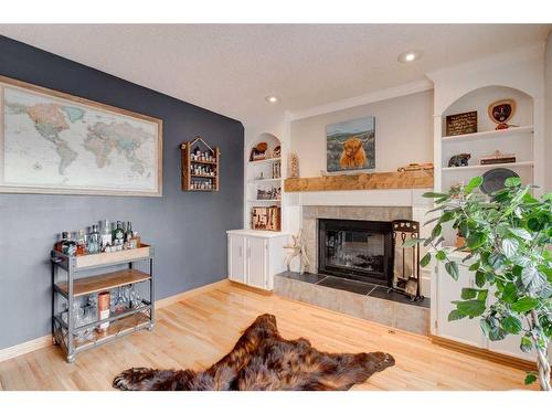 16 Ranchridge Crescent Nw, Calgary, AB - Indoor Photo Showing Living Room With Fireplace