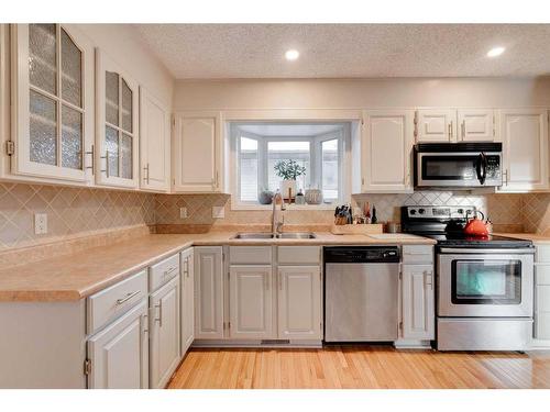 16 Ranchridge Crescent Nw, Calgary, AB - Indoor Photo Showing Kitchen With Stainless Steel Kitchen With Double Sink