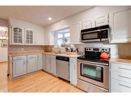 16 Ranchridge Crescent Nw, Calgary, AB - Indoor Photo Showing Kitchen With Stainless Steel Kitchen With Double Sink