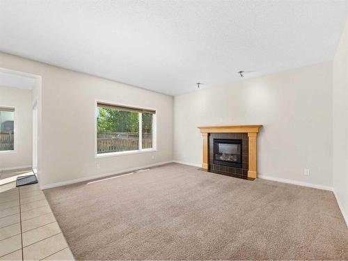 21 Cranwell Square Se, Calgary, AB - Indoor Photo Showing Living Room With Fireplace