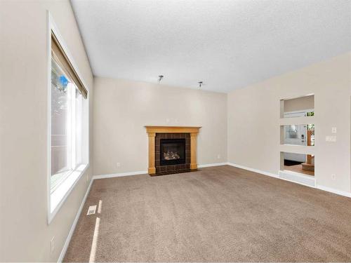 21 Cranwell Square Se, Calgary, AB - Indoor Photo Showing Living Room With Fireplace