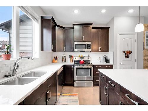 1701 Legacy Circle Se, Calgary, AB - Indoor Photo Showing Kitchen With Stainless Steel Kitchen With Double Sink With Upgraded Kitchen