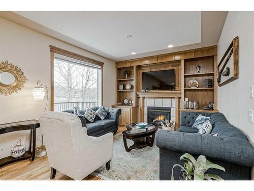 191 Rocky Ridge Landing Nw, Calgary, AB - Indoor Photo Showing Living Room With Fireplace