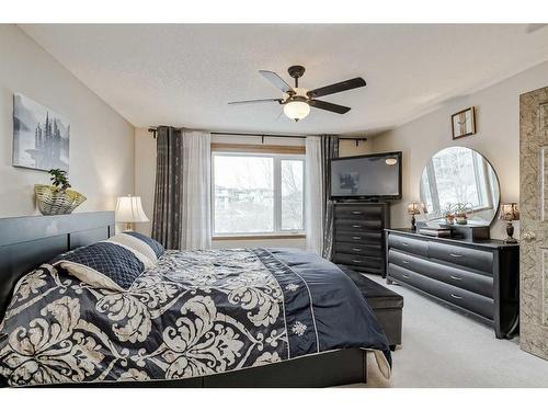 191 Rocky Ridge Landing Nw, Calgary, AB - Indoor Photo Showing Bedroom