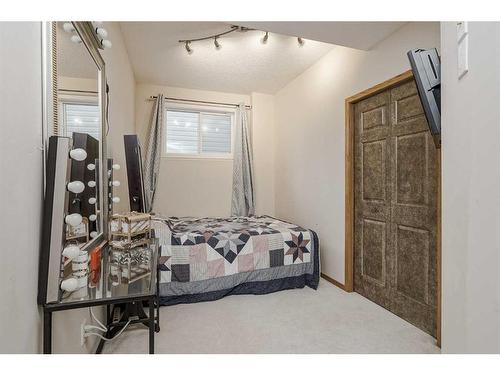 191 Rocky Ridge Landing Nw, Calgary, AB - Indoor Photo Showing Bedroom