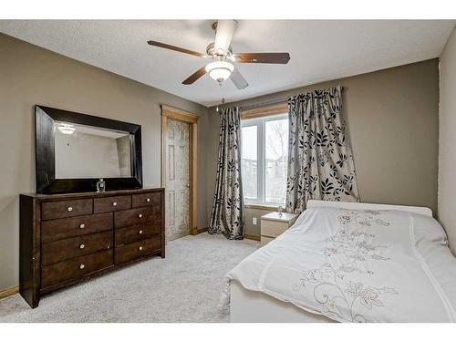 191 Rocky Ridge Landing Nw, Calgary, AB - Indoor Photo Showing Bedroom