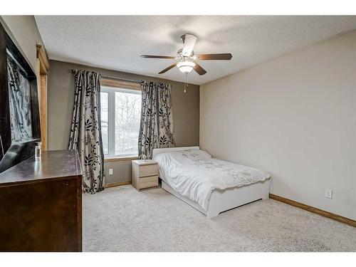 191 Rocky Ridge Landing Nw, Calgary, AB - Indoor Photo Showing Bedroom