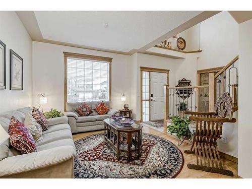 191 Rocky Ridge Landing Nw, Calgary, AB - Indoor Photo Showing Living Room