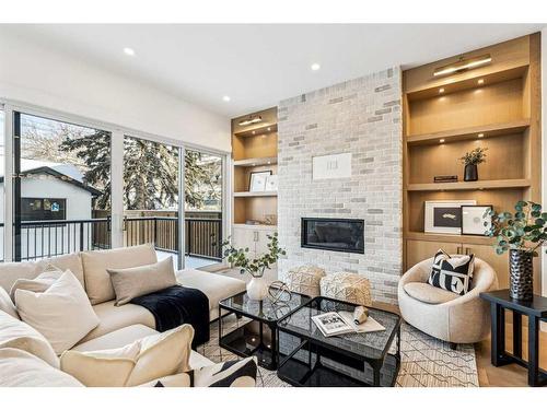 1618 Bowness Road Nw, Calgary, AB - Indoor Photo Showing Living Room With Fireplace