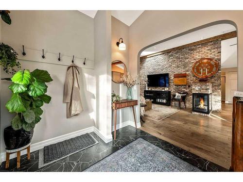 528 14 Avenue Ne, Calgary, AB - Indoor Photo Showing Other Room With Fireplace