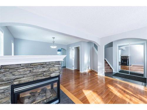 96 Taradale Drive Ne, Calgary, AB - Indoor Photo Showing Living Room With Fireplace