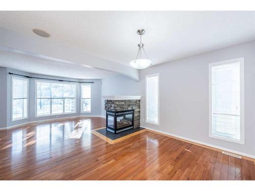 96 Taradale Drive Ne, Calgary, AB - Indoor Photo Showing Living Room With Fireplace