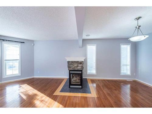 96 Taradale Drive Ne, Calgary, AB - Indoor With Fireplace