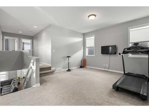 99 Evansfield Rise Nw, Calgary, AB - Indoor Photo Showing Gym Room