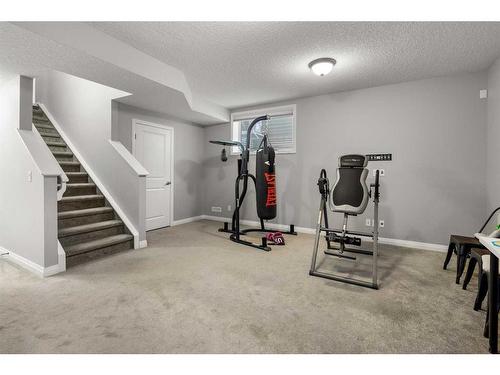 99 Evansfield Rise Nw, Calgary, AB - Indoor Photo Showing Gym Room