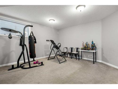 99 Evansfield Rise Nw, Calgary, AB - Indoor Photo Showing Gym Room