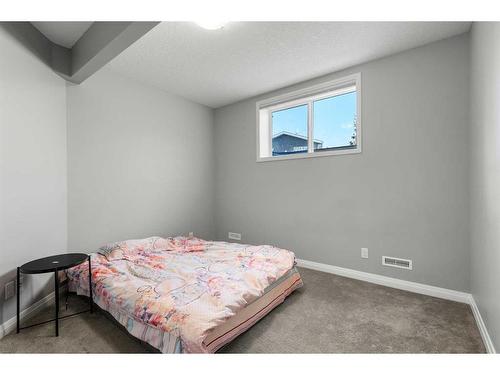 99 Evansfield Rise Nw, Calgary, AB - Indoor Photo Showing Bedroom