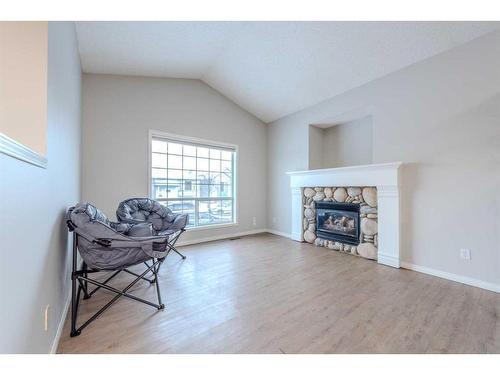 214 Erin Circle Se, Calgary, AB - Indoor Photo Showing Living Room With Fireplace