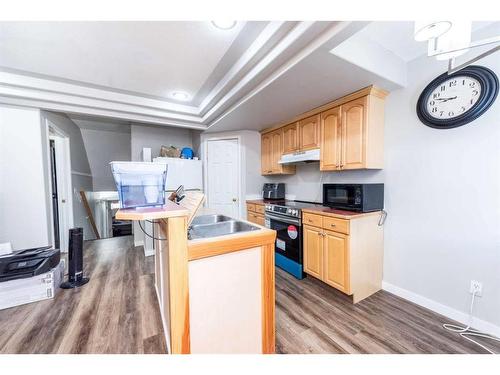 214 Erin Circle Se, Calgary, AB - Indoor Photo Showing Kitchen With Double Sink