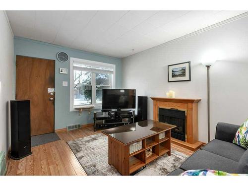 1532 19 Avenue Nw, Calgary, AB - Indoor Photo Showing Living Room With Fireplace