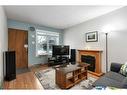 1532 19 Avenue Nw, Calgary, AB  - Indoor Photo Showing Living Room With Fireplace 