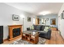 1532 19 Avenue Nw, Calgary, AB  - Indoor Photo Showing Living Room With Fireplace 