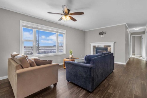 421 Main Street, Champion, AB - Indoor Photo Showing Living Room With Fireplace