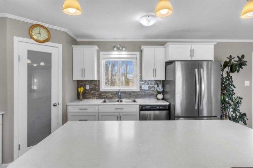 421 Main Street, Champion, AB - Indoor Photo Showing Kitchen With Stainless Steel Kitchen With Double Sink