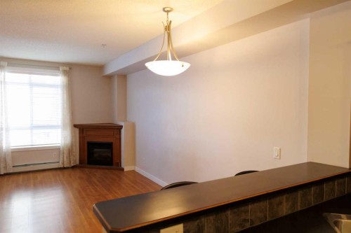 206-323 18 Avenue Sw, Calgary, AB - Indoor With Fireplace