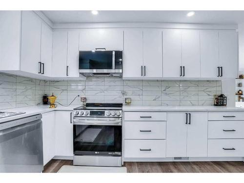 52 Millward Place Ne, Calgary, AB - Indoor Photo Showing Kitchen With Upgraded Kitchen