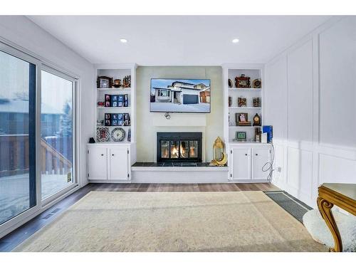 52 Millward Place Ne, Calgary, AB - Indoor Photo Showing Other Room With Fireplace