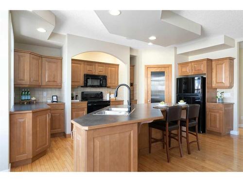 12 Tuscany Glen Place Nw, Calgary, AB - Indoor Photo Showing Kitchen With Double Sink