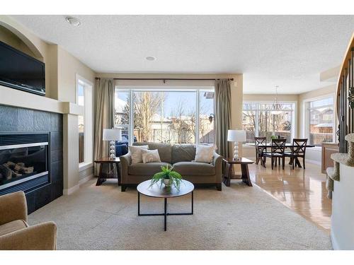 12 Tuscany Glen Place Nw, Calgary, AB - Indoor Photo Showing Living Room With Fireplace