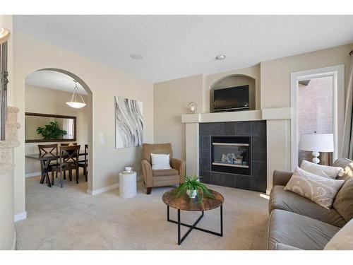 12 Tuscany Glen Place Nw, Calgary, AB - Indoor Photo Showing Living Room With Fireplace