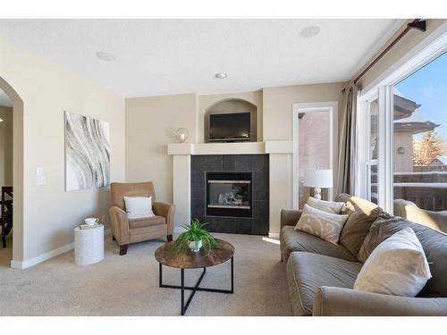 12 Tuscany Glen Place Nw, Calgary, AB - Indoor Photo Showing Living Room With Fireplace