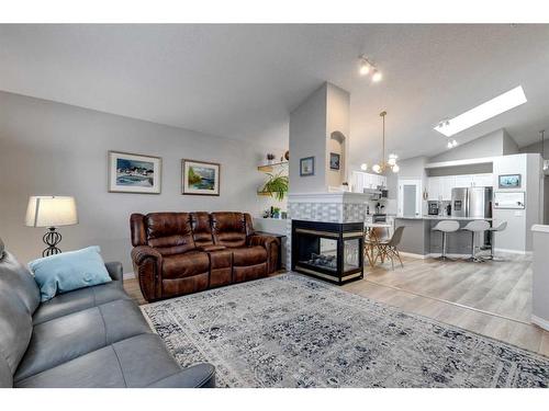 229 Chaparral Villas Se, Calgary, AB - Indoor Photo Showing Living Room With Fireplace