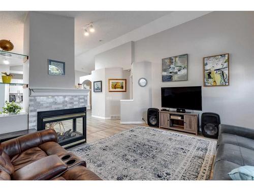 229 Chaparral Villas Se, Calgary, AB - Indoor Photo Showing Living Room With Fireplace