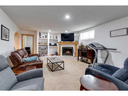 229 Chaparral Villas Se, Calgary, AB - Indoor Photo Showing Living Room With Fireplace