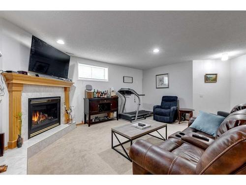 229 Chaparral Villas Se, Calgary, AB - Indoor Photo Showing Living Room With Fireplace