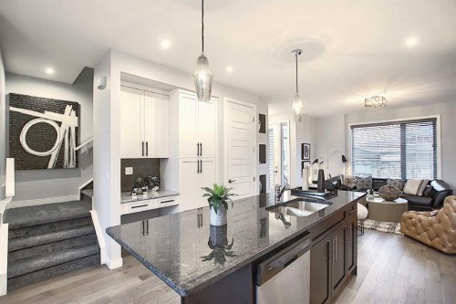 322 Sundown Road, Cochrane, AB - Indoor Photo Showing Kitchen With Double Sink With Upgraded Kitchen