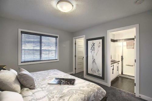 322 Sundown Road, Cochrane, AB - Indoor Photo Showing Bedroom