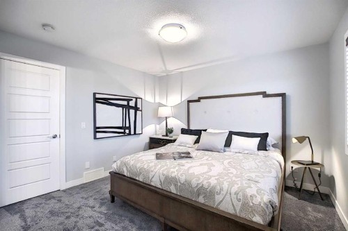 322 Sundown Road, Cochrane, AB - Indoor Photo Showing Bedroom